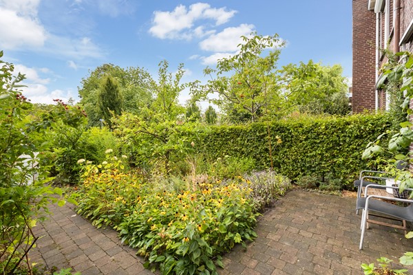 Foto - Te koop: Sfeervolle tussenwoning met groene oase!